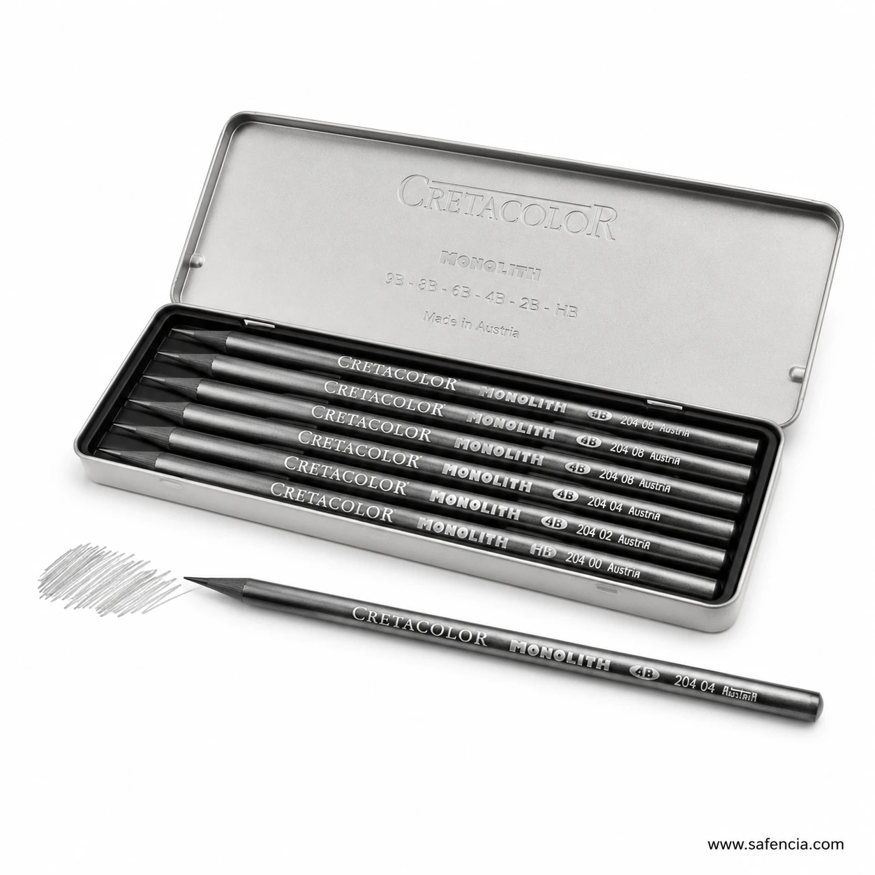Open Cretacolor tin containing Monolith graphite pencils with one loose pencil and drawn swatches