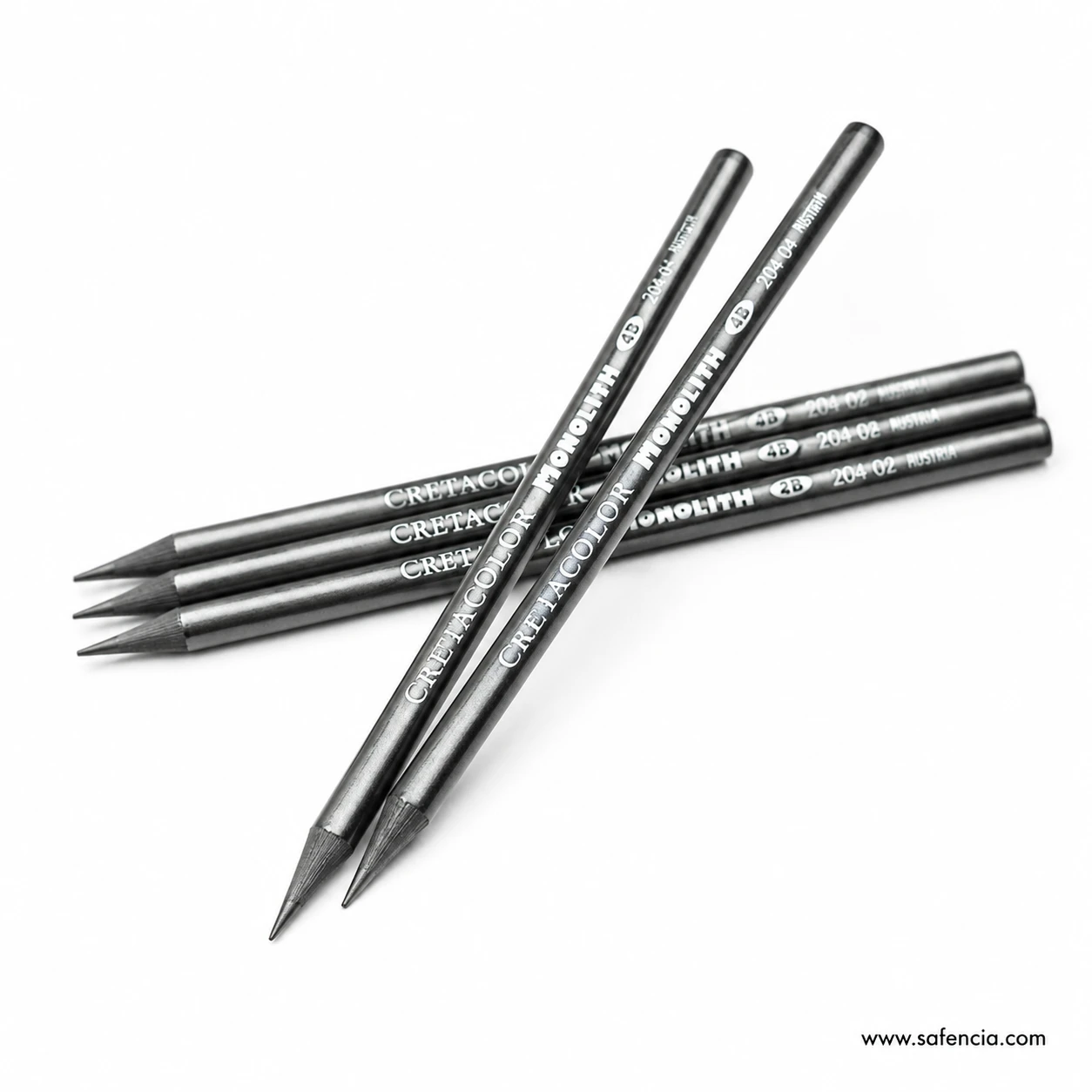 Cretacolor Monolith solid graphite pencils crossed over a small group on a white background