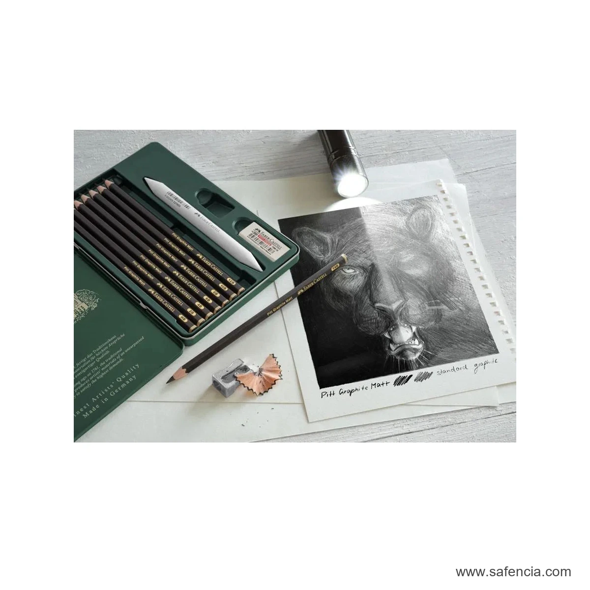 Faber-Castell Pitt Graphite Matt tin and drawing setup with the complete artist pencil kit visible