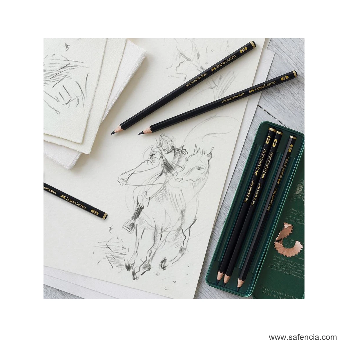 Faber-Castell Pitt Graphite Matt six-pencil tin shown beside graphite artwork and a loose drawing pencil
