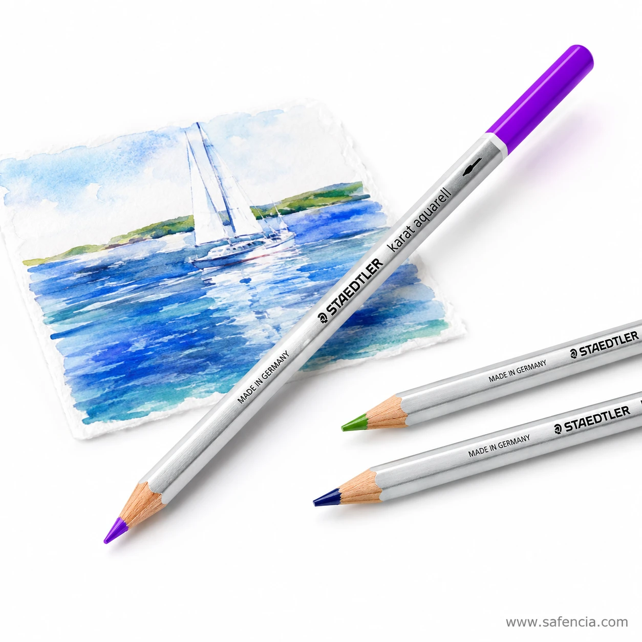 Staedtler Karat Aquarell purple watercolour pencil close up with the coloured end cap visible above a painted sea study