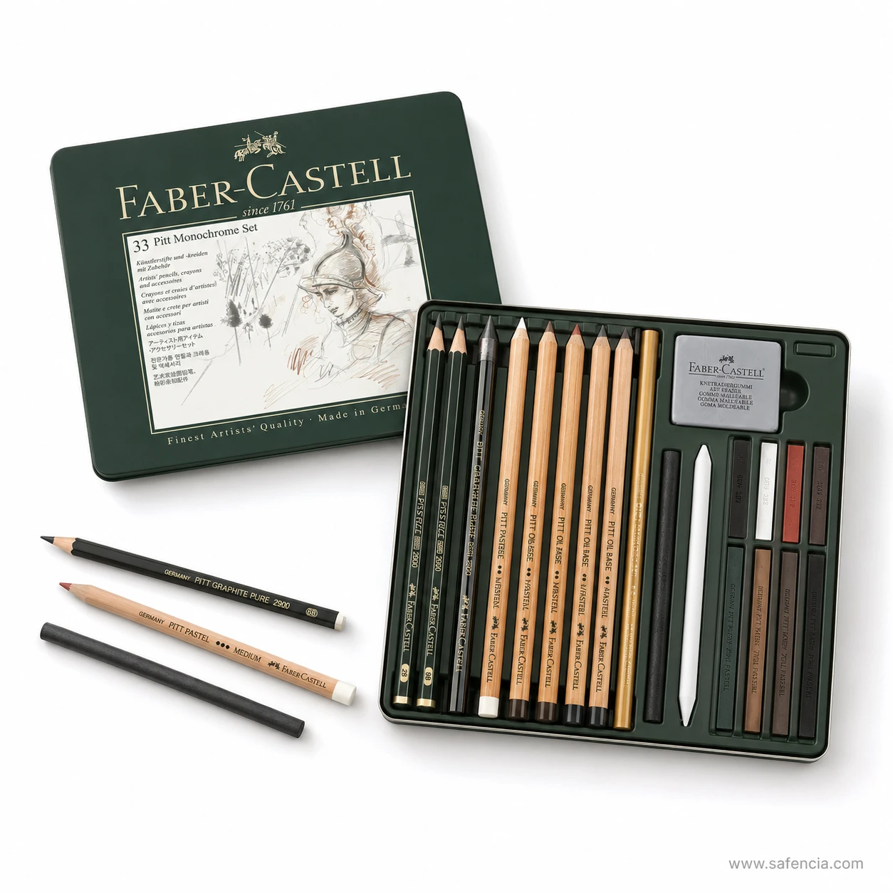 The closed Faber-Castell 33 Pitt Monochrome tin beside its open tray with three loose pencils in front