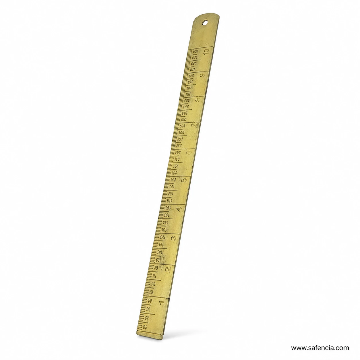 Close view of brass Patwari ruler showing fine graduation lines and reference numbers on gold surface