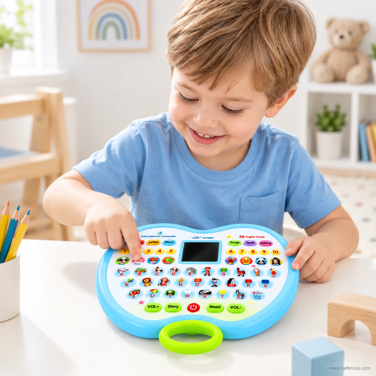 Scene of a young child at a table pressing the keys on the blue apple shaped learning pad