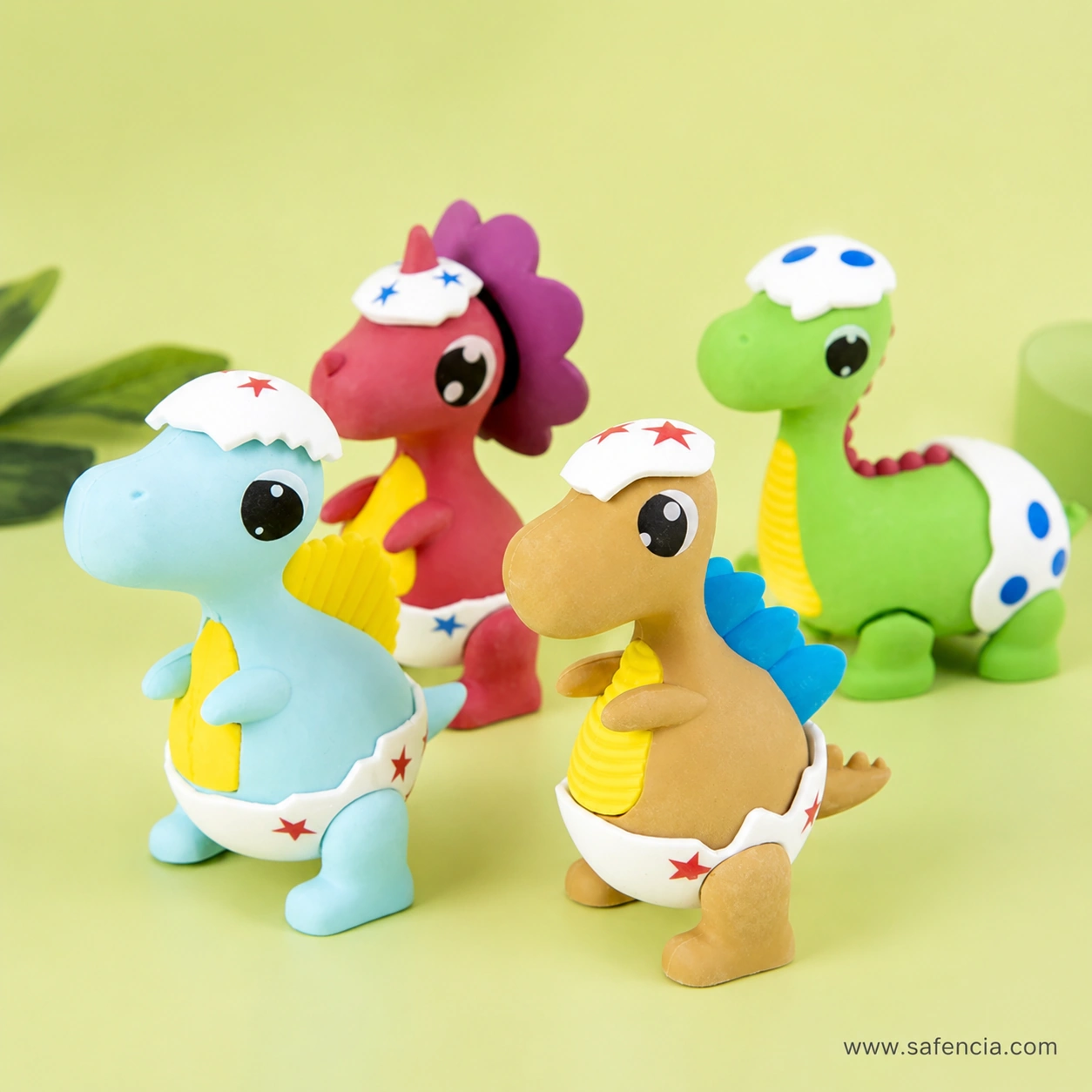 Close view of the baby dinosaur erasers at an angle, with the blue and brown figures in front showing their moulded fins and spikes
