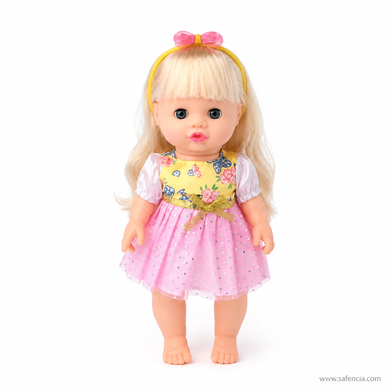 Musical baby doll standing alone in her yellow floral bodice and pink glitter tulle skirt