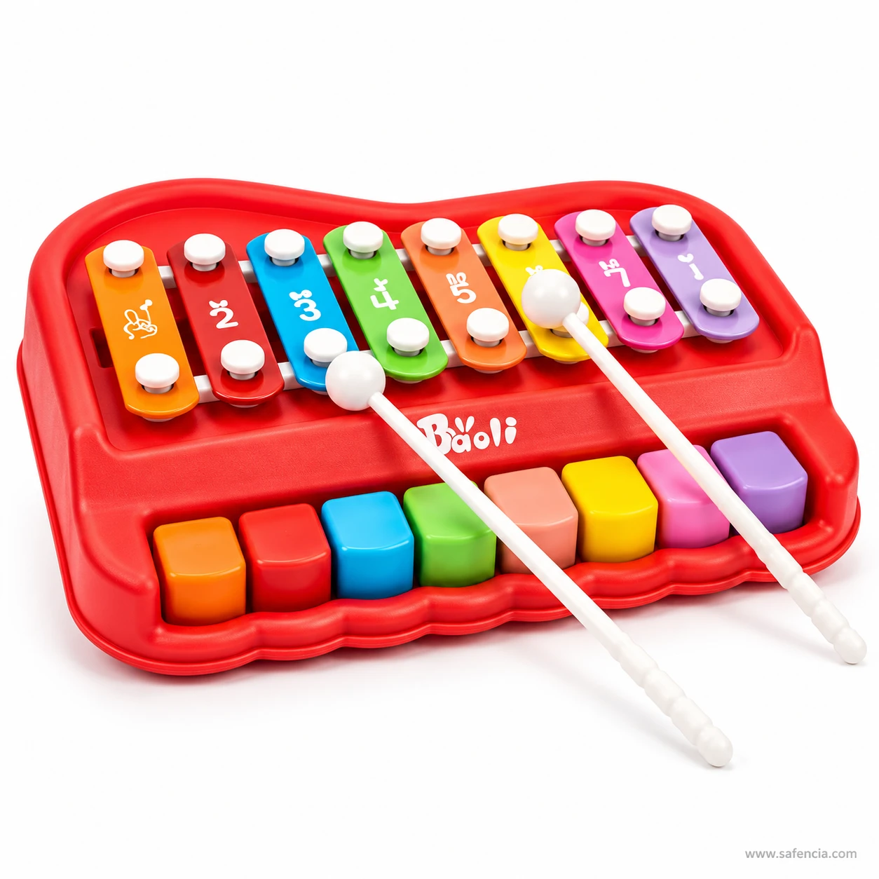 Two white mallets resting on the coloured bars of the red Baoli xylophone piano, ready for tapping