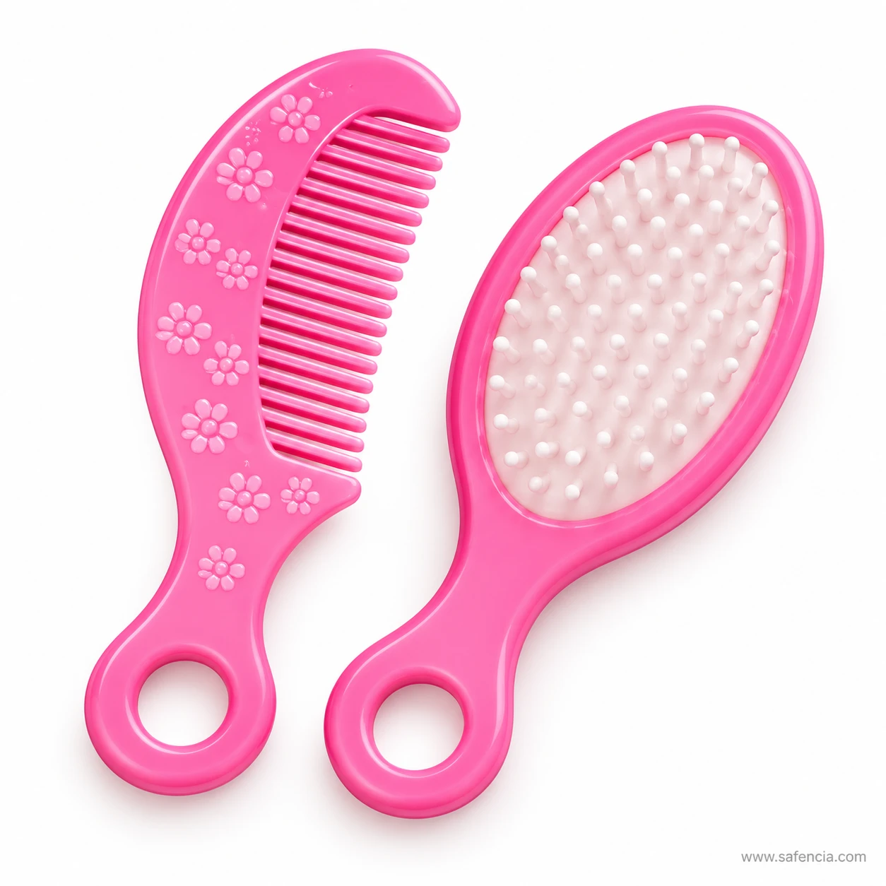 Pink flower-printed comb and pink paddle hairbrush with white bristles from the Beauty Boutique beauty set