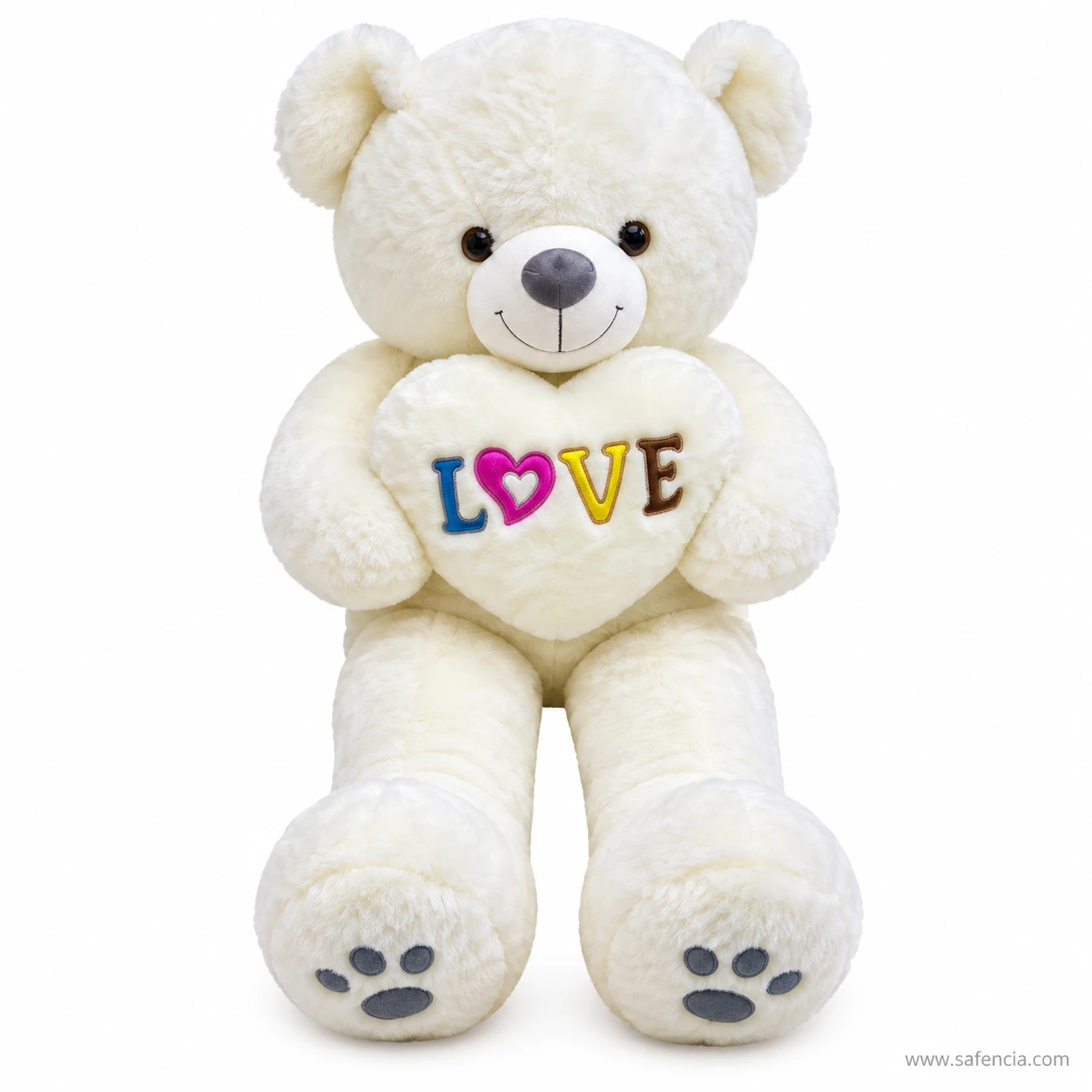 White 100 cm teddy bear holding a white heart with LOVE stitched in blue, pink, yellow and brown