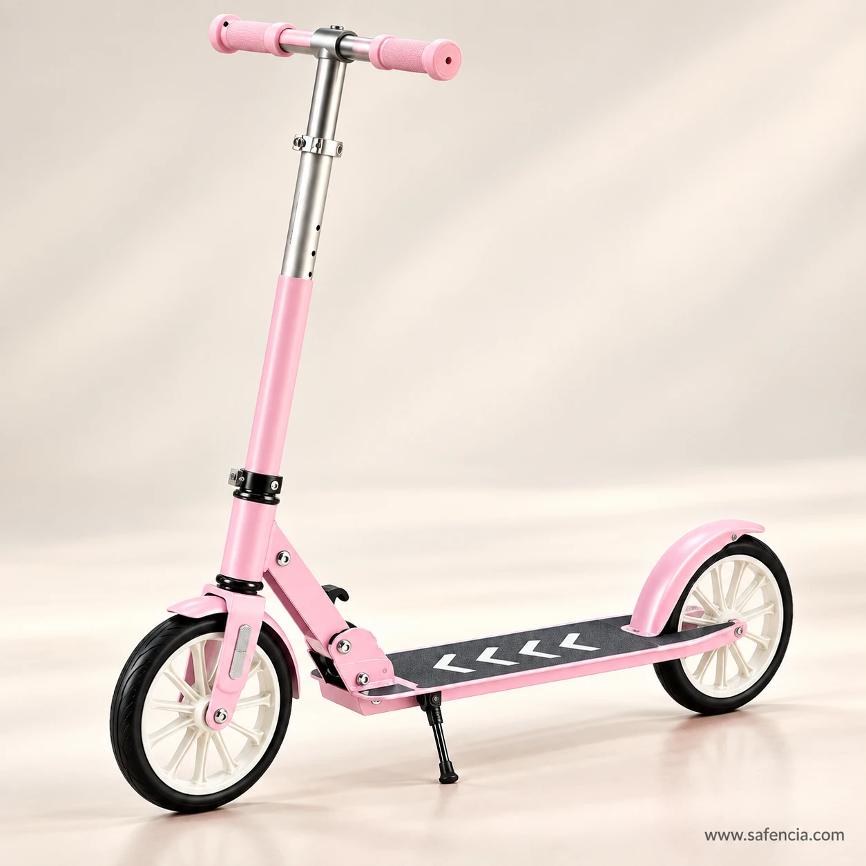 Pastel pink two-wheel kick scooter with white wheels on a soft background