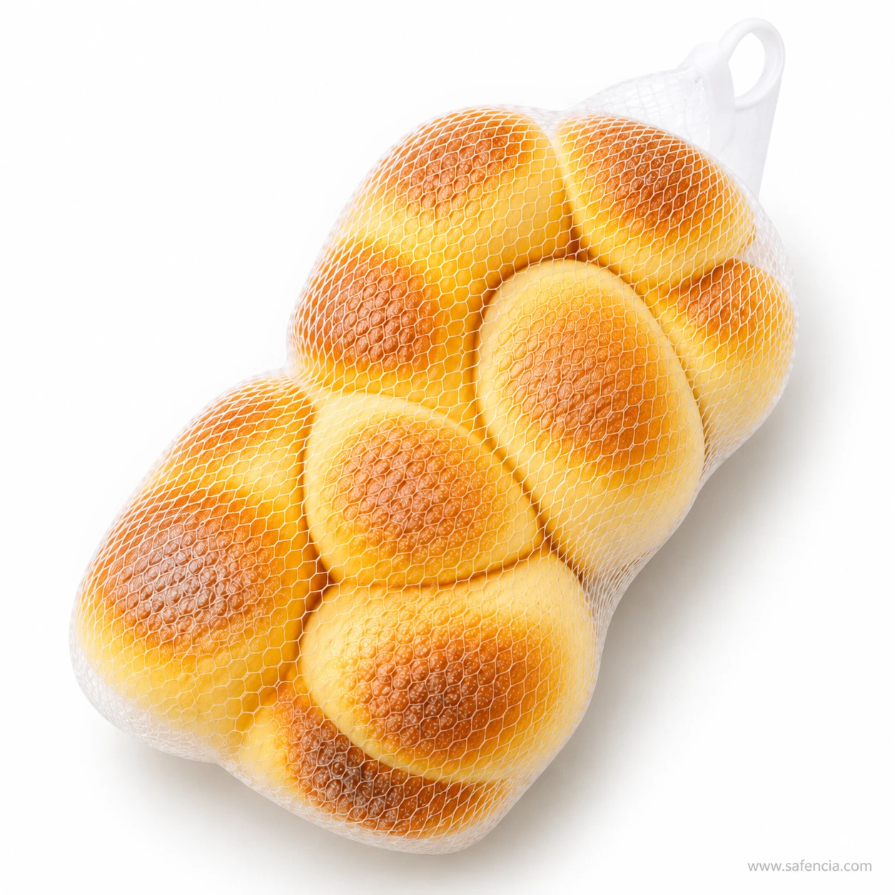 Angled view of the braided bread loaf squishy showing the twisted golden lobes in the net