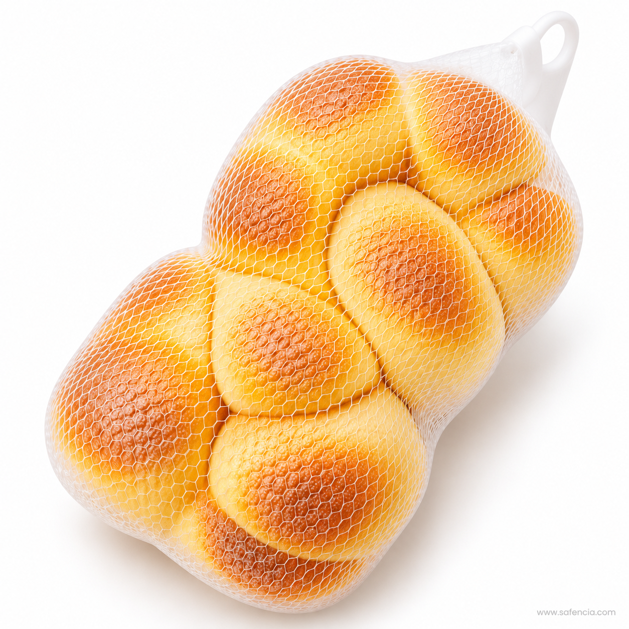 Braided bread loaf squishy lying on its side in its white mesh bag on a white background
