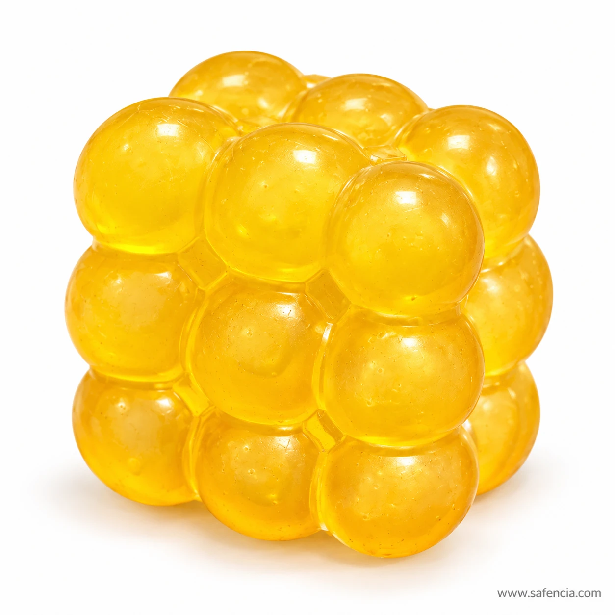 Translucent yellow bubble squishy cube made of glossy rounded bumps on a white background