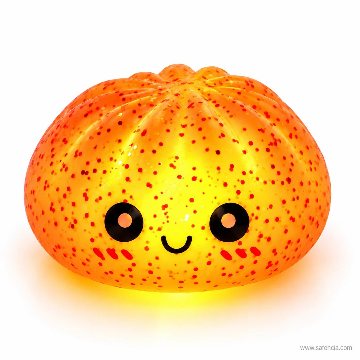 Orange bun squishy night light glowing warmly with glitter flecks and a smiling face with pink cheeks