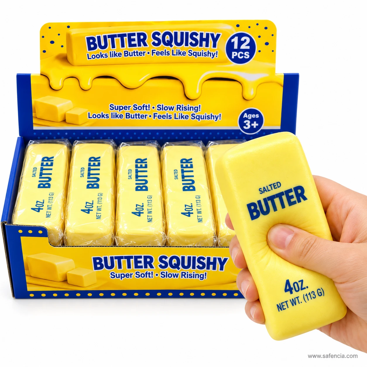 Hand holding a butter squishy upright beside the open butter squishy shop display box