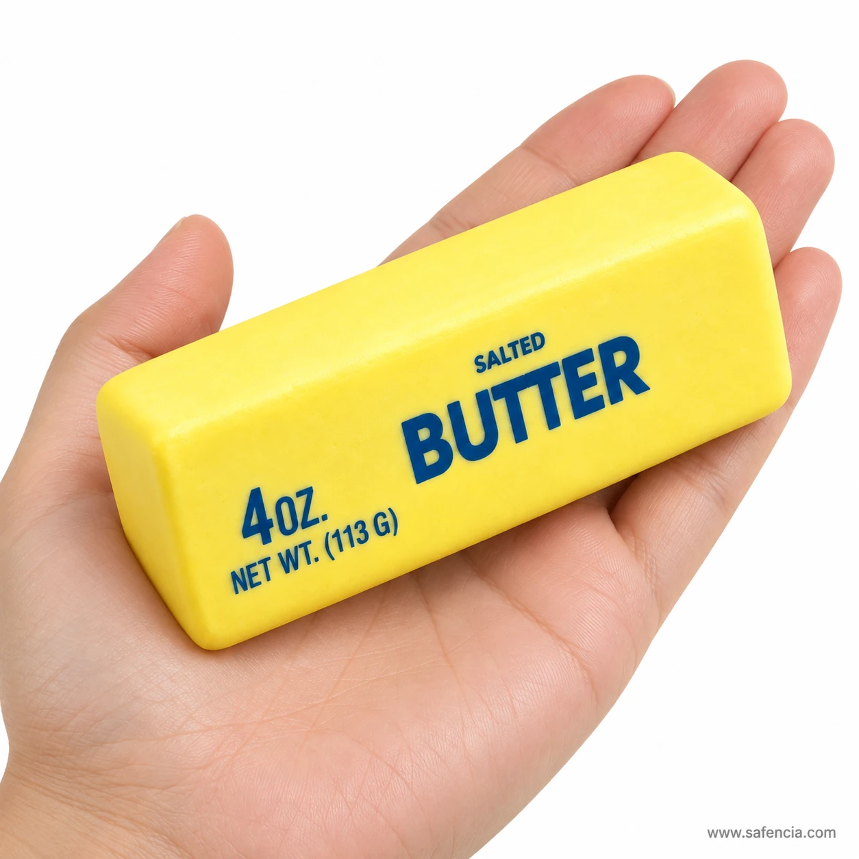 Butter squishy lying across an open palm to show its size against an adult hand