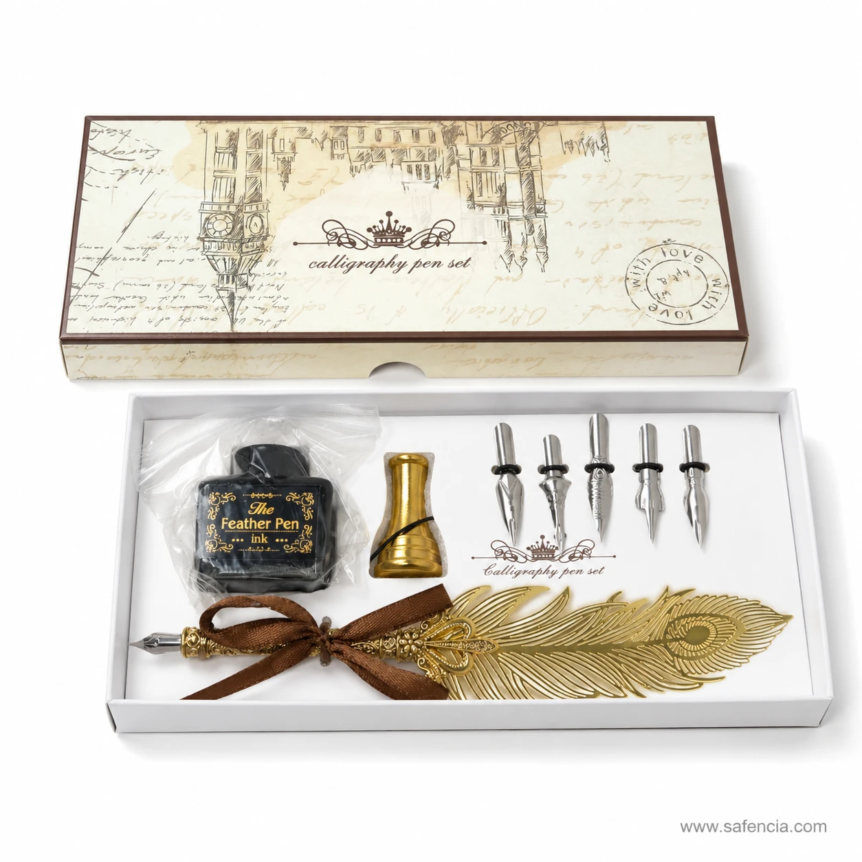 Golden feather calligraphy pen set open beside its printed lid, showing pen, nibs, ink bottle and stand in the tray