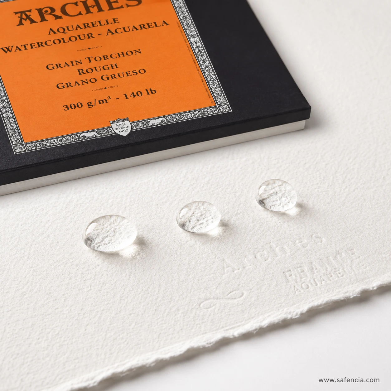 Water droplets beading evenly on gelatin-sized Arches watercolor paper