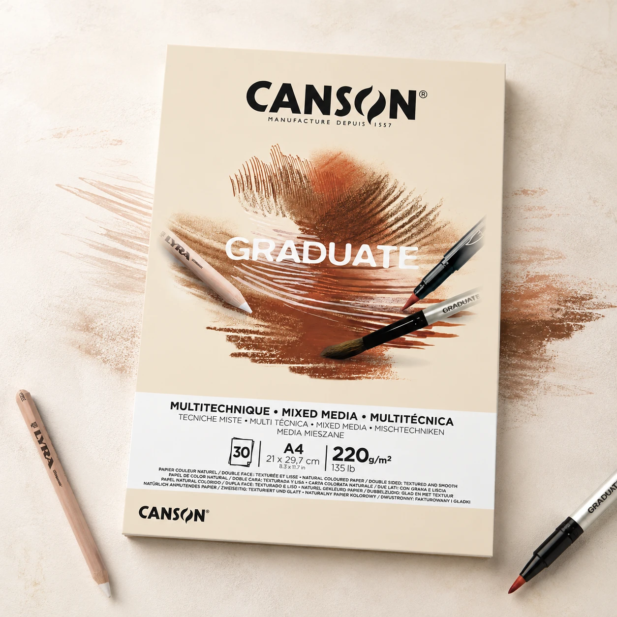 Drawing pencils and strokes on Canson Graduate yellow ochre textured paper