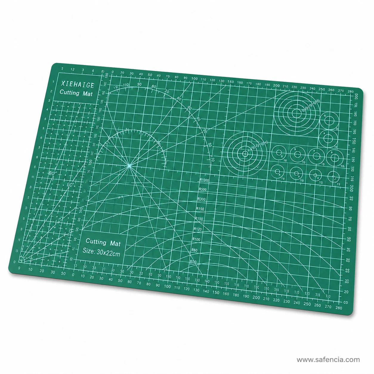Double sided green cutting mat laid flat on artist studio workstation