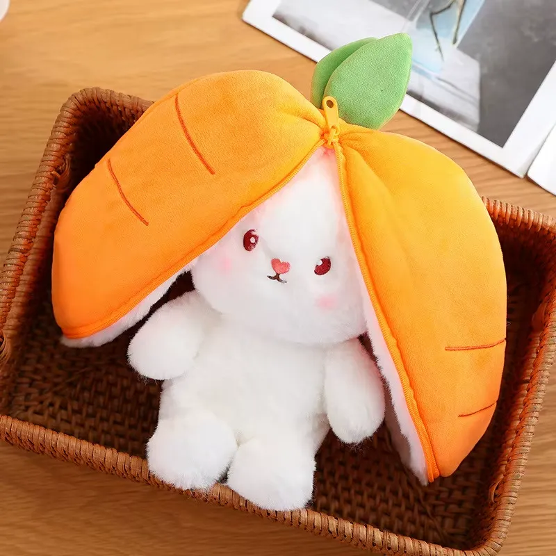Carrot Bunny Plush Toy sitting in basket with orange hood opened around face
