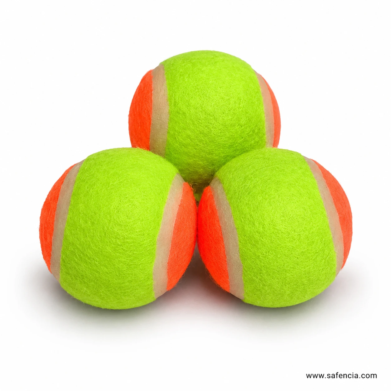Chamki tennis ball close up showing orange and green panels and pale seam