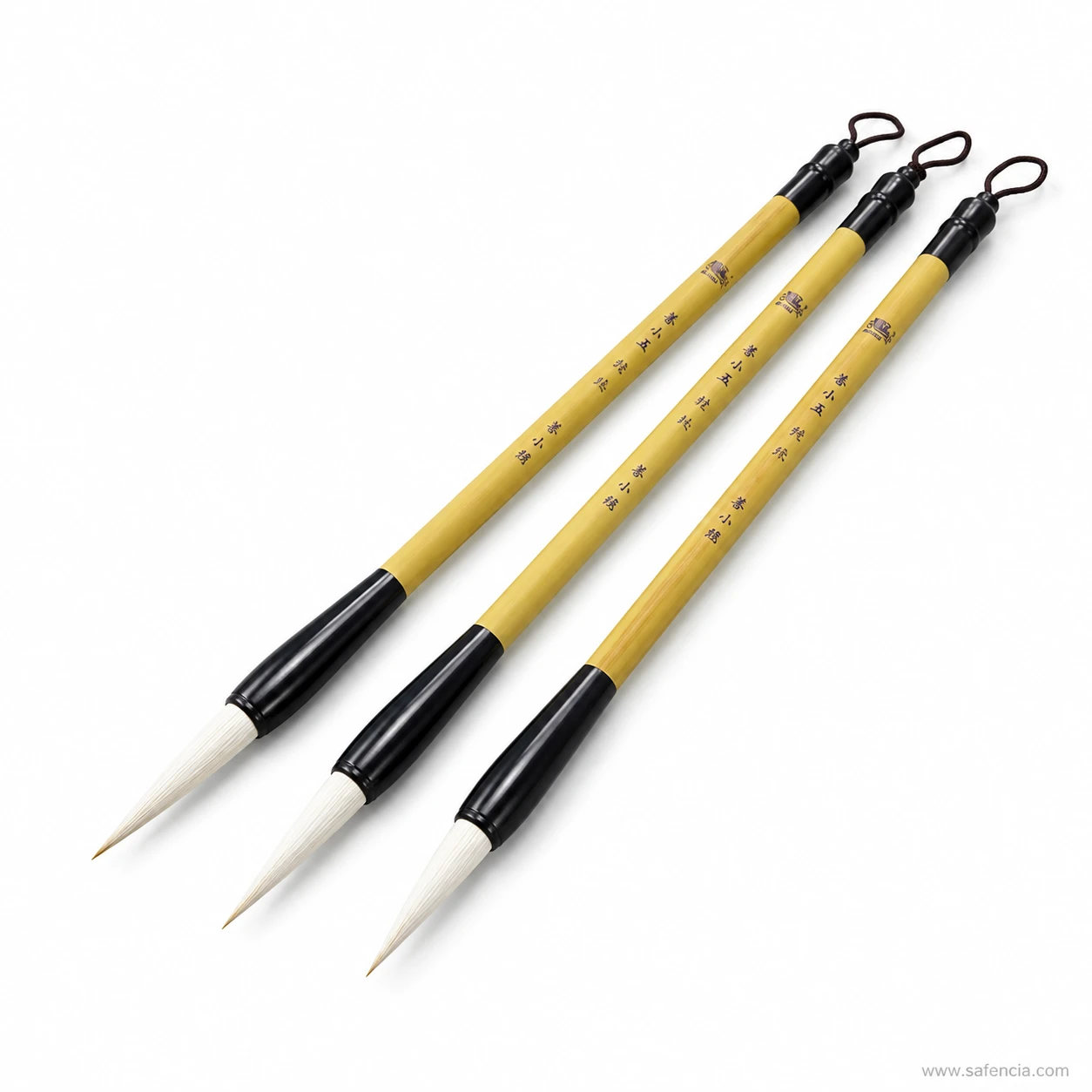 Three Chinese-style calligraphy brushes with pointed round tips laid together