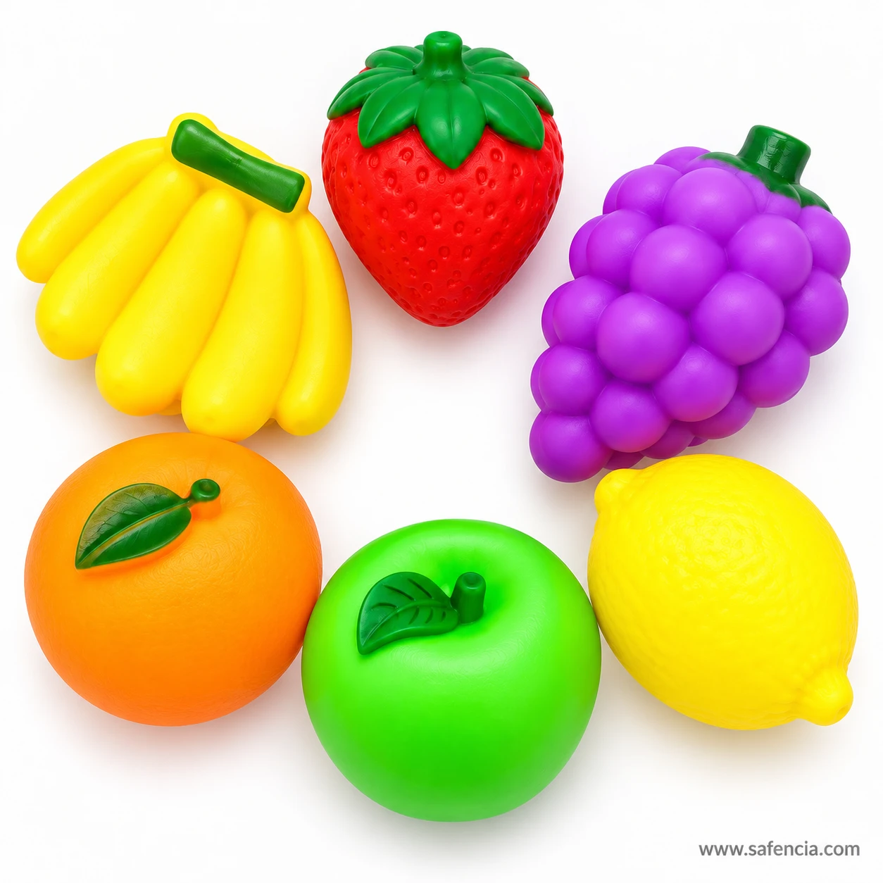 Close-up of the six squeaky fruit toys showing the bumpy grapes, seeded strawberry and leafy orange