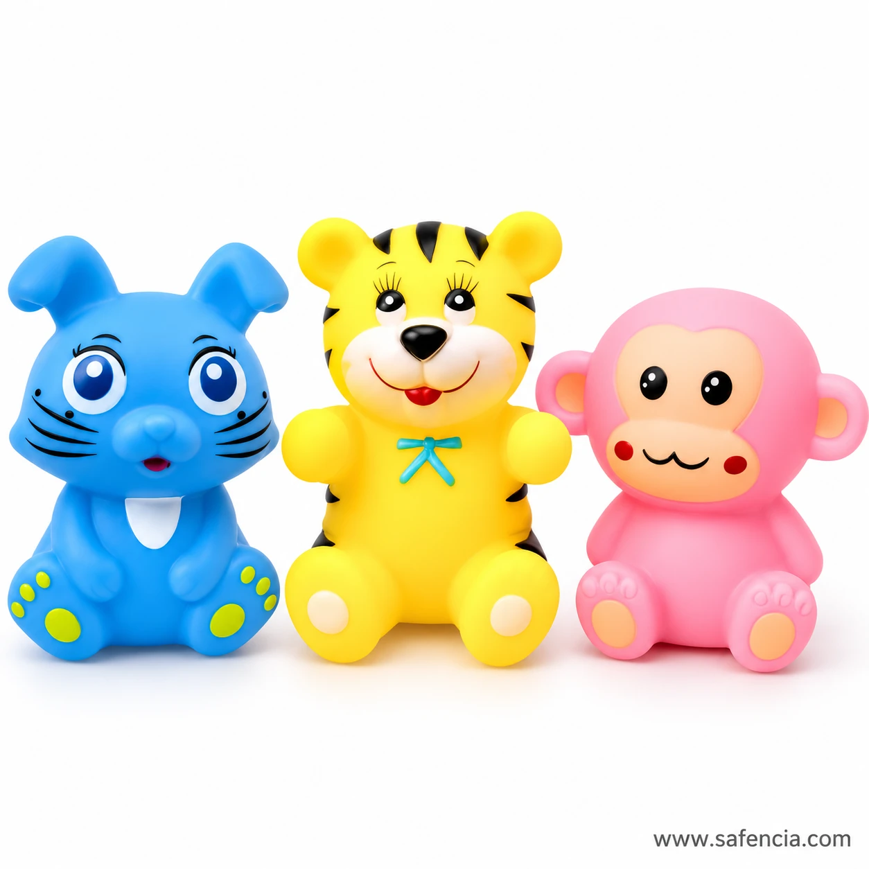Blue rabbit, yellow tiger and pink monkey chu chu toys standing side by side on a white surface