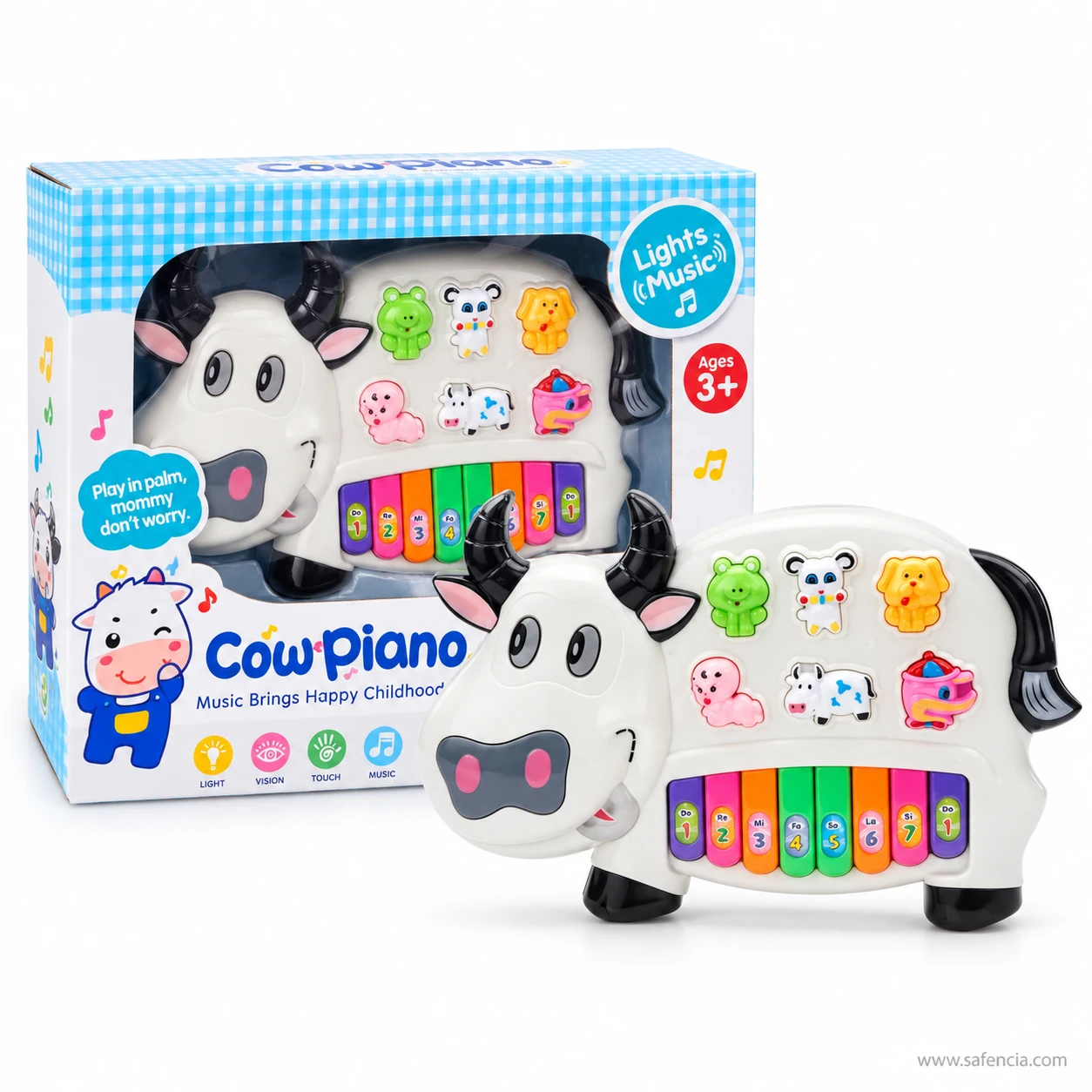 Cow piano keyboard toy in front of its window box printed Cow Piano, Lights Music, Ages 3+