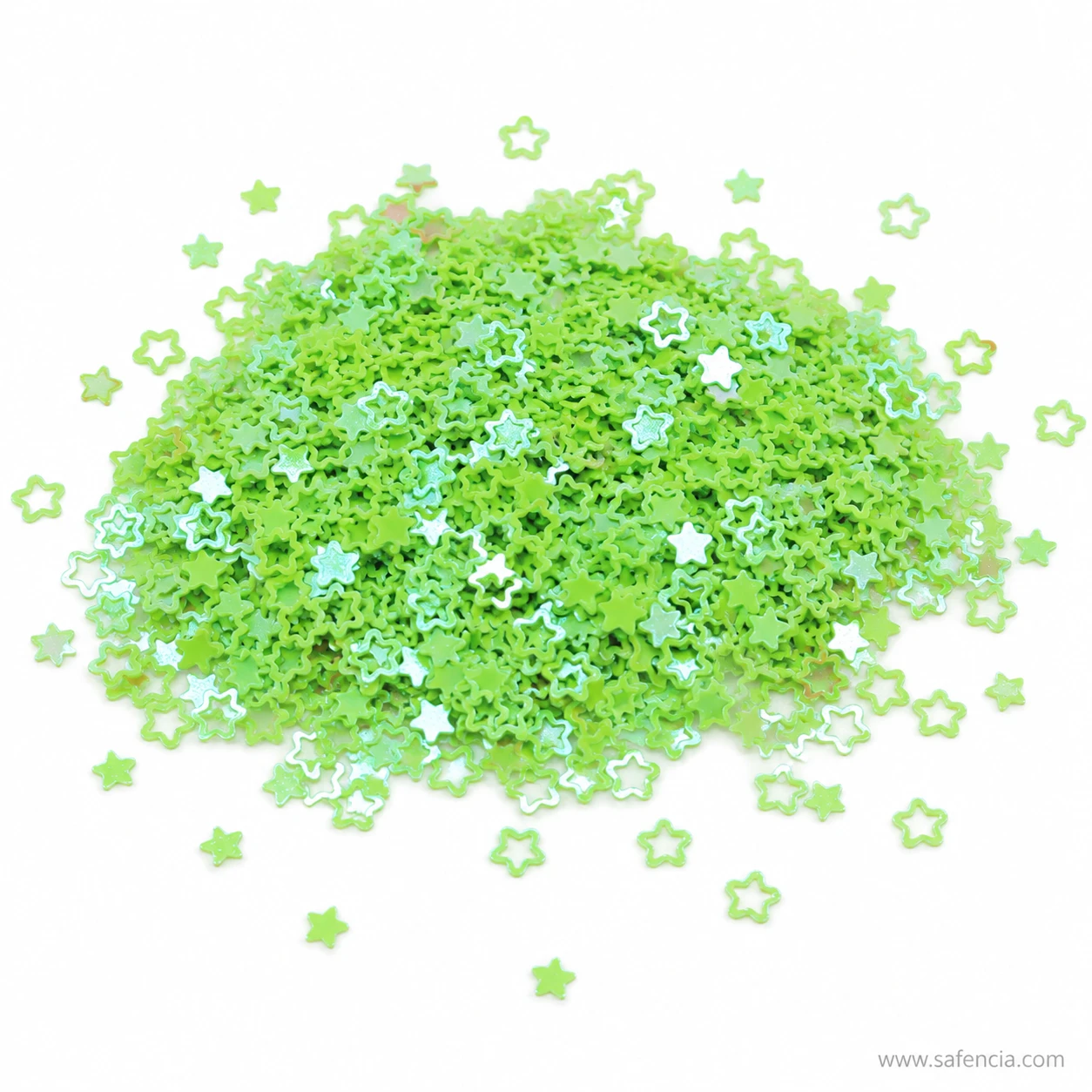 Heaped pile of green star sequins showing the mix of sizes in the pack