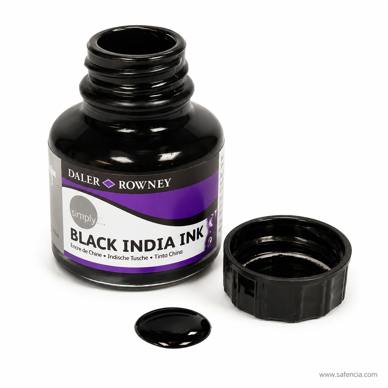 Pooled drop of black India ink showing its glossy surface beside the open jar