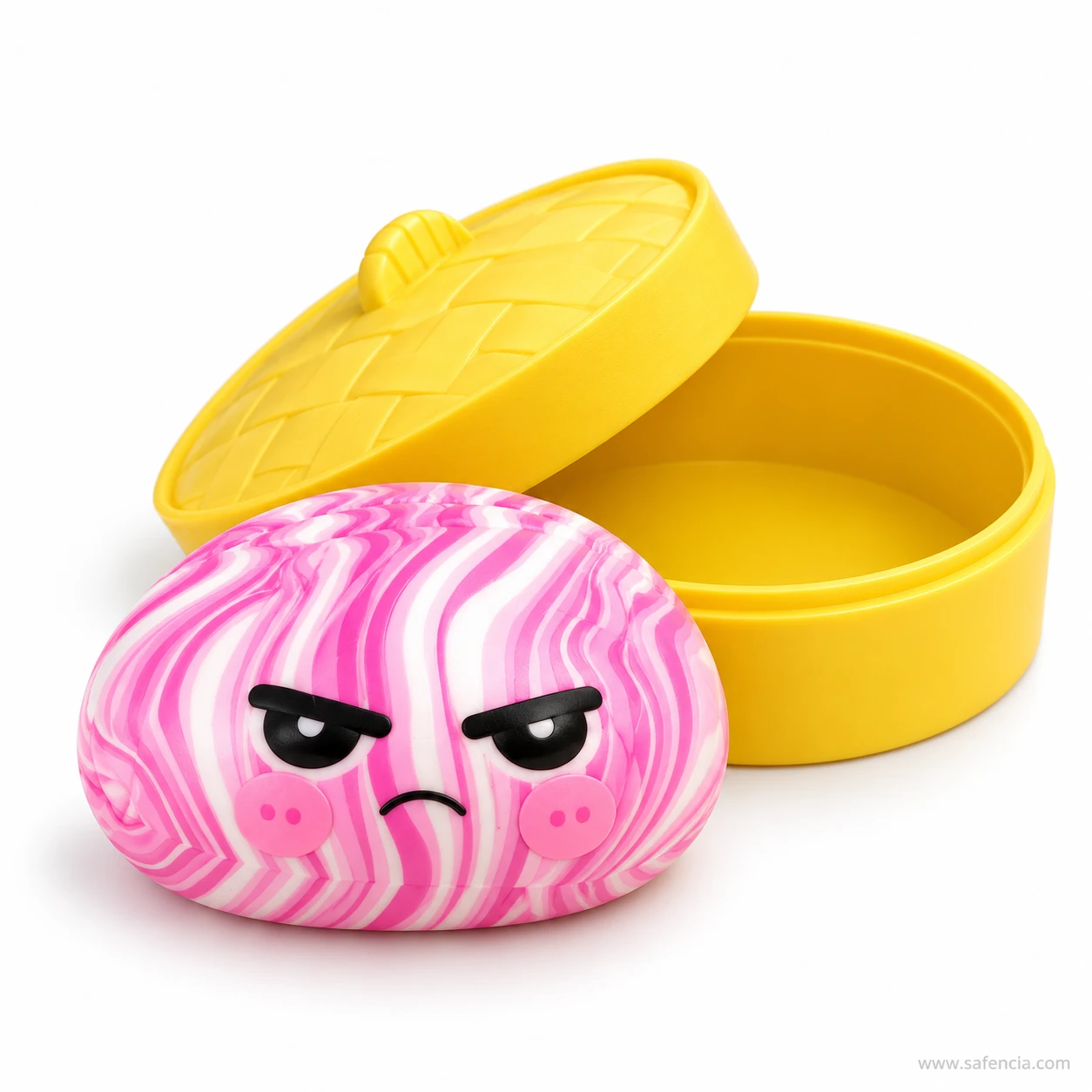 Pink swirl dumpling squishy with a cross cartoon face resting in front of an open yellow steamer case