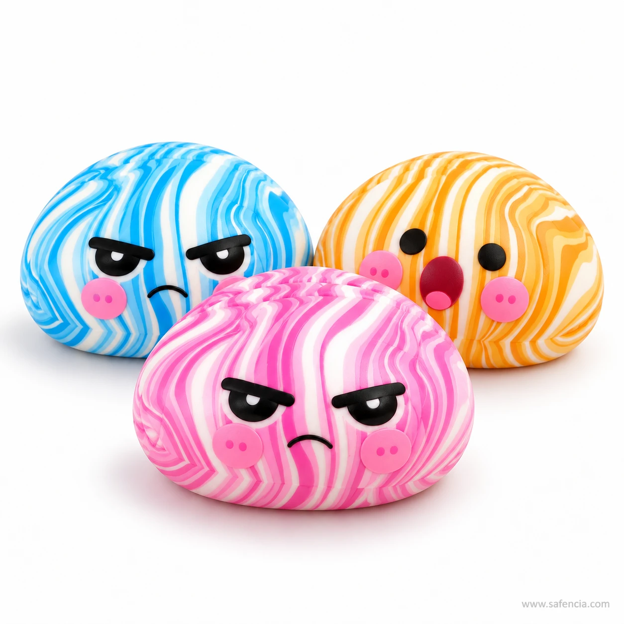 Three dumpling squishies in blue, orange and pink swirl with grumpy, surprised and cross cartoon faces
