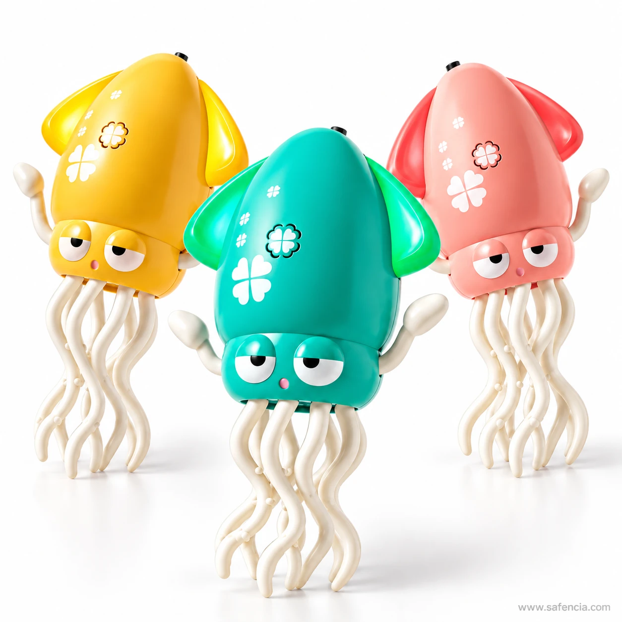 The three squid toys photographed at an angle showing their fins, arms and tentacle skirts