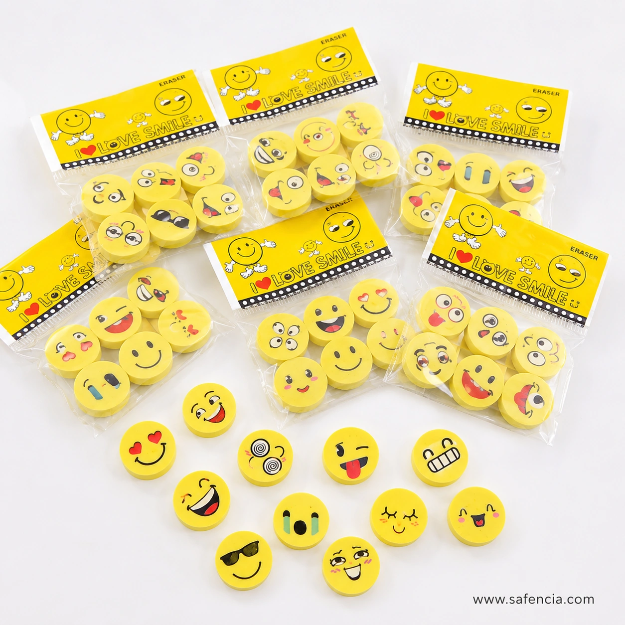 Six sealed emoji eraser bags each holding four yellow face erasers, every bag showing a different combination of expressions