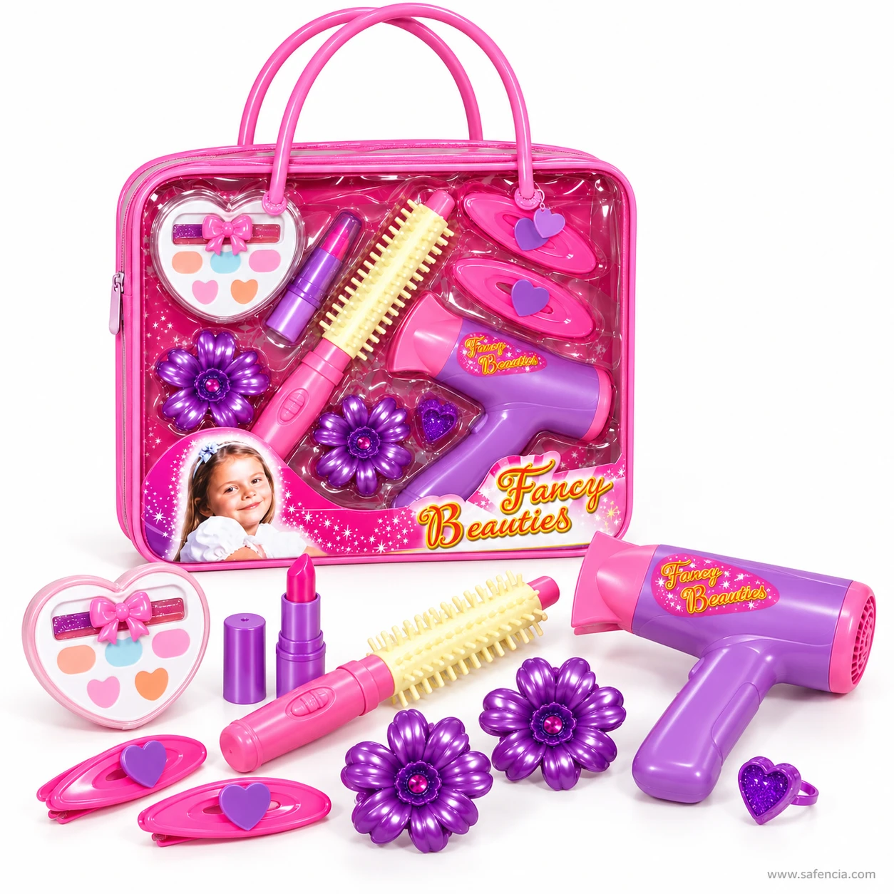 Fancy Beauties purple flower hair clips, pink oval heart clips and glitter heart ring beside the dryer and brush