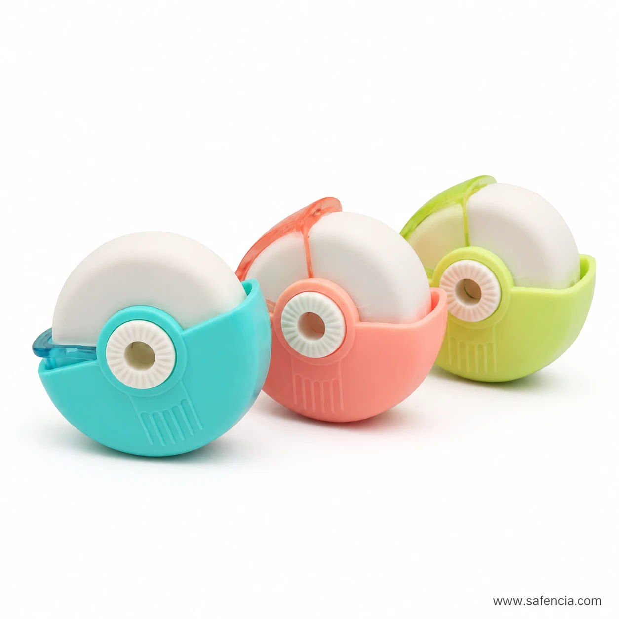 Teal, coral and green eraser sharpeners lined up with their white eraser discs rising above the coloured shells