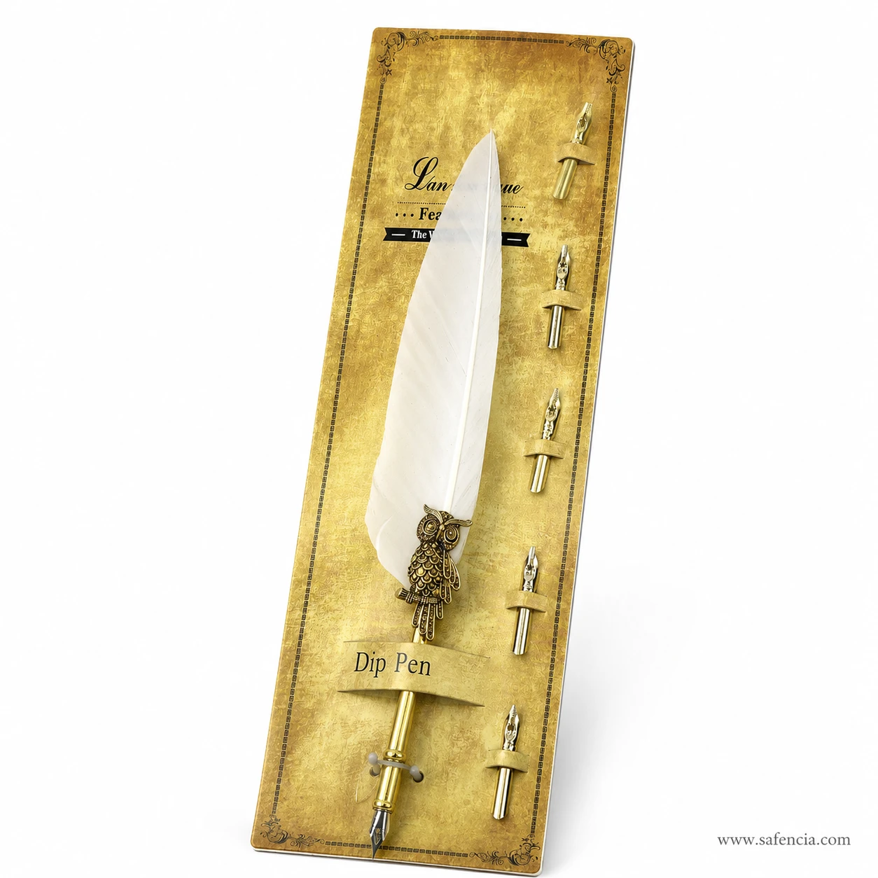 Angled view of the feather dip pen showing the cast owl at the feather join and the gold-toned metal barrel