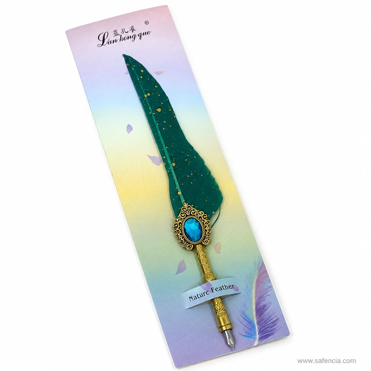 Close view of the large faceted blue stone set in the pierced gold filigree mount of the feather dip pen