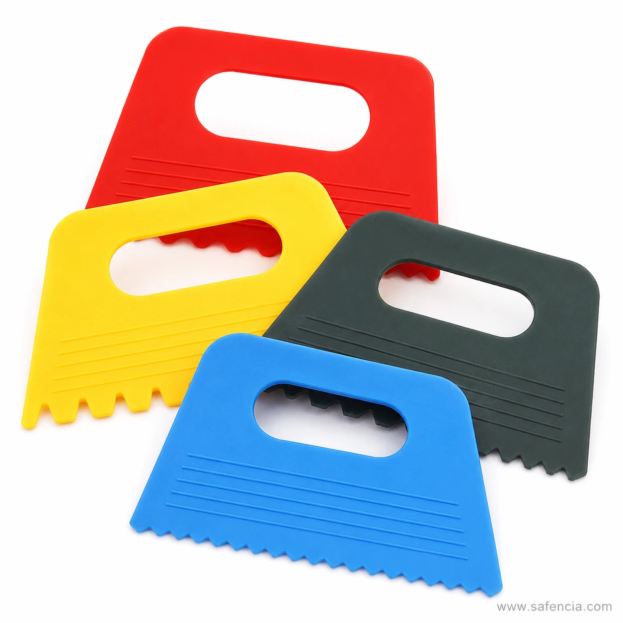 Close view of the four scraper combs showing scallops sawtooth and square teeth