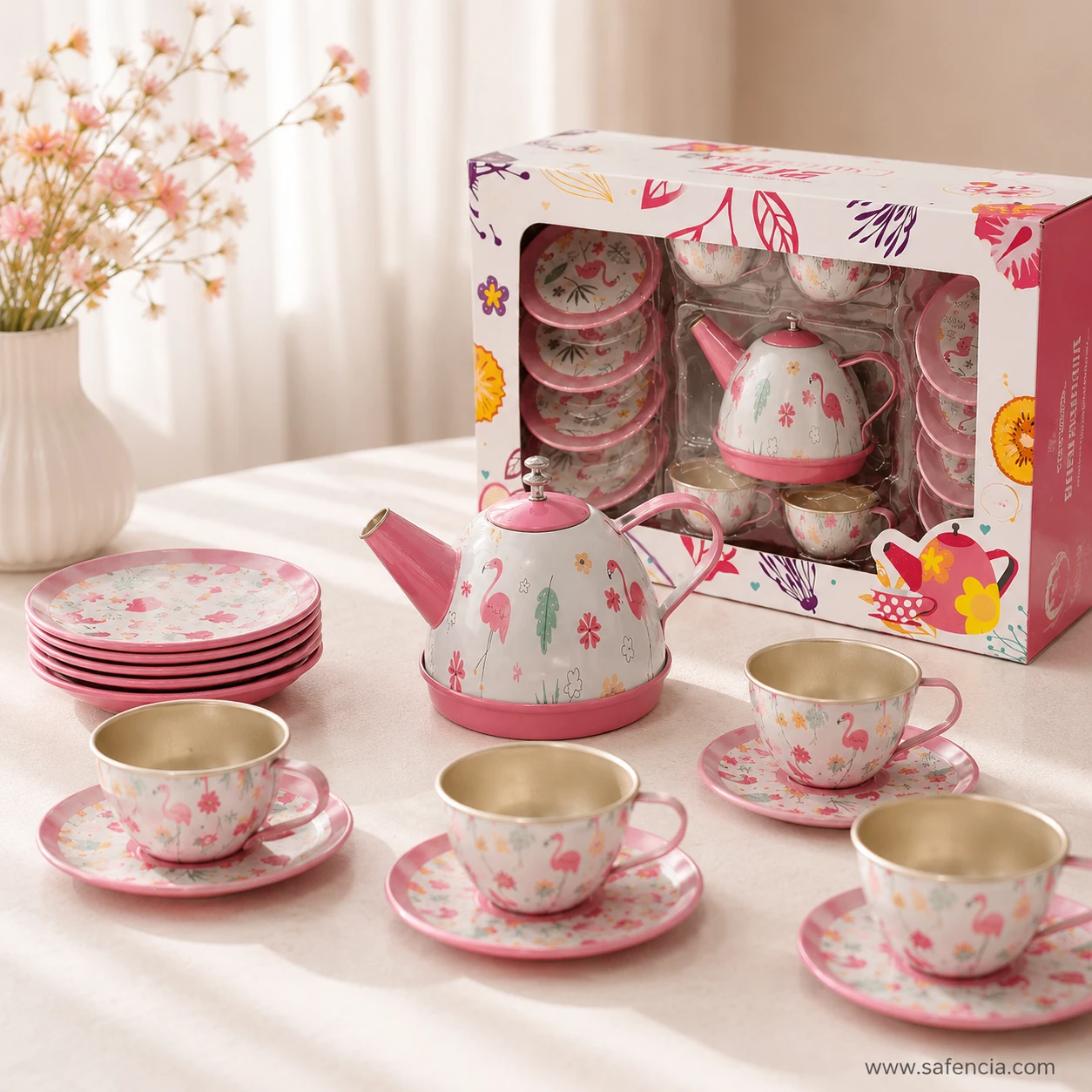 Four flamingo print cups on saucers with a stack of matching side plates and the teapot on a table