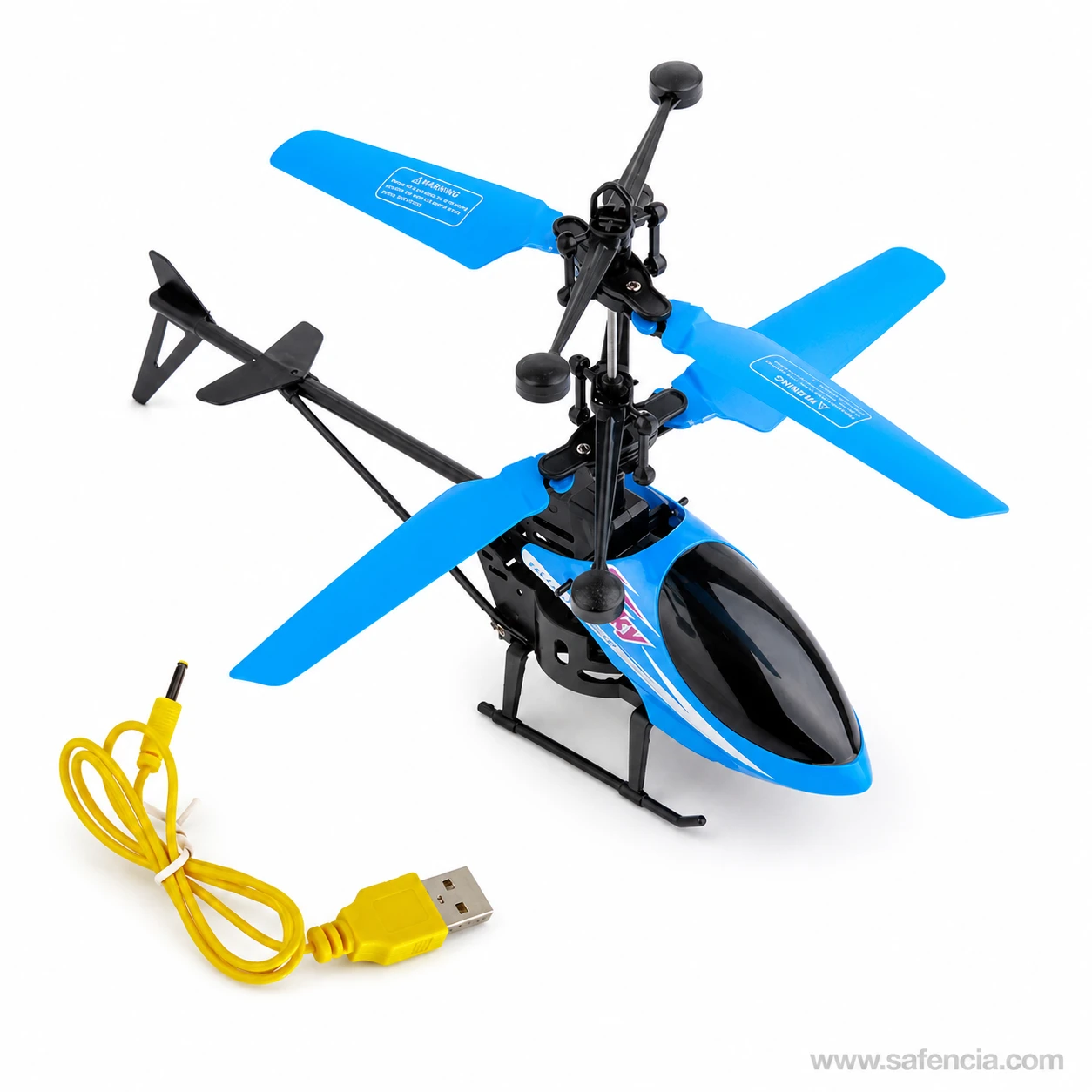 Palm sensor flying helicopter beside the yellow USB charging cable supplied with it