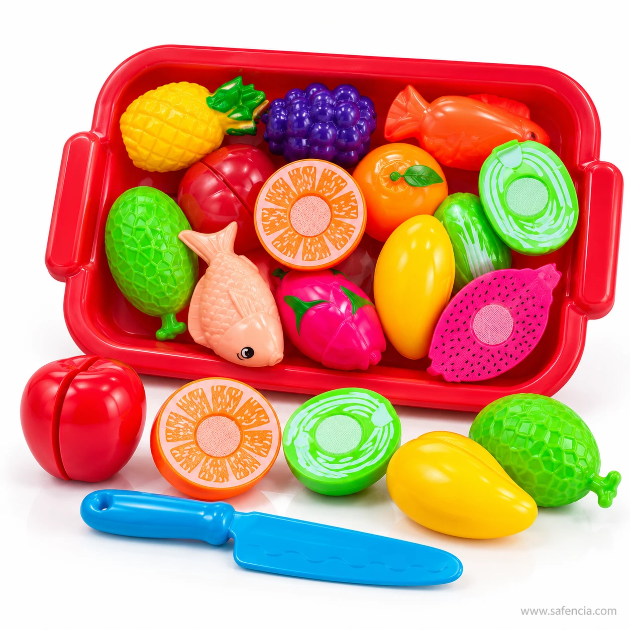 Velcro apple, orange half, cabbage, mango and green fruit in front of the red tray with the blue toy knife