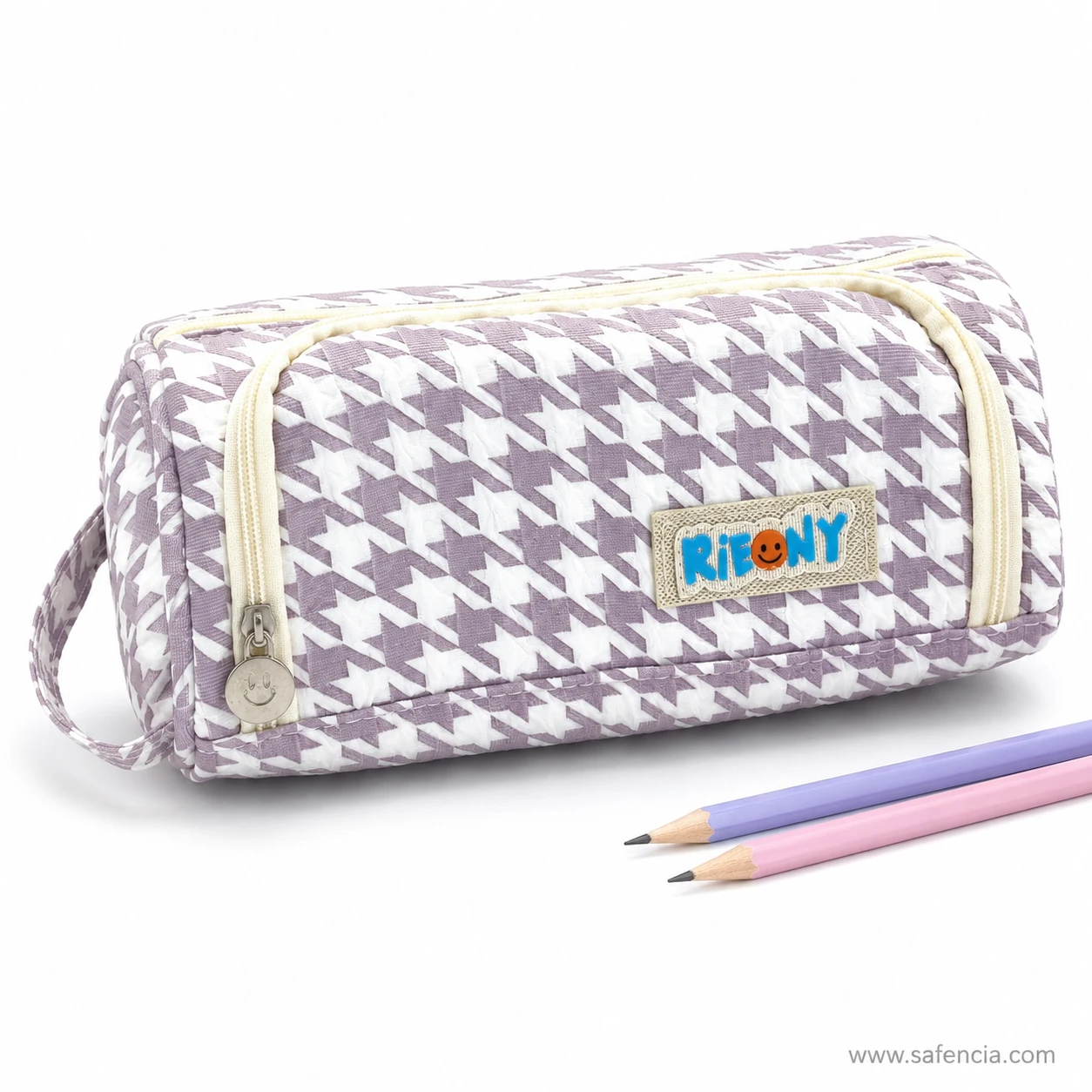 Houndstooth barrel pencil pouch beside pastel pencils for scale