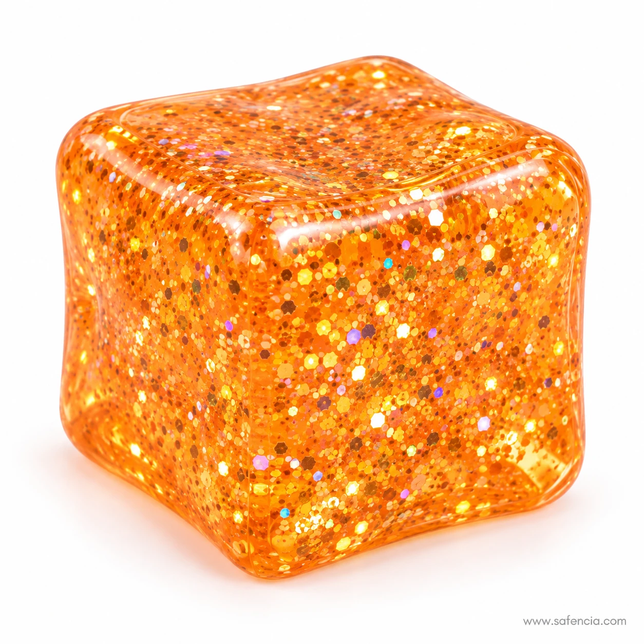 Close view of an orange glitter squishy cube with gold and silver flakes suspended in its clear body