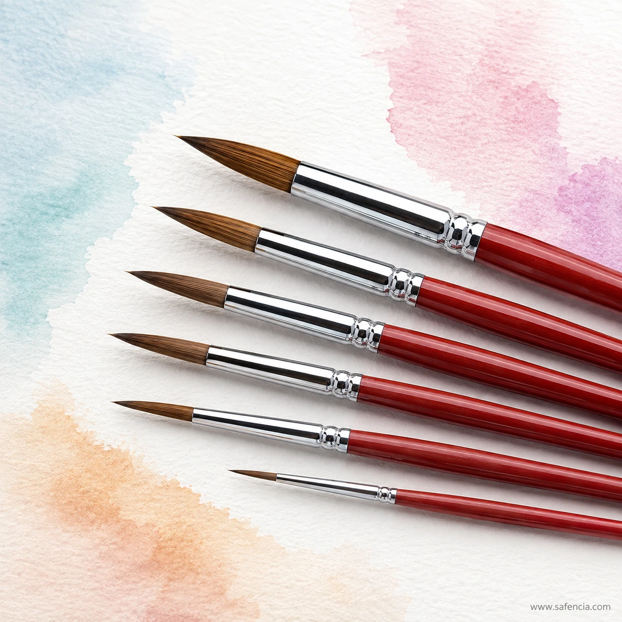 Habico Sablon round brushes resting on washed watercolour paper