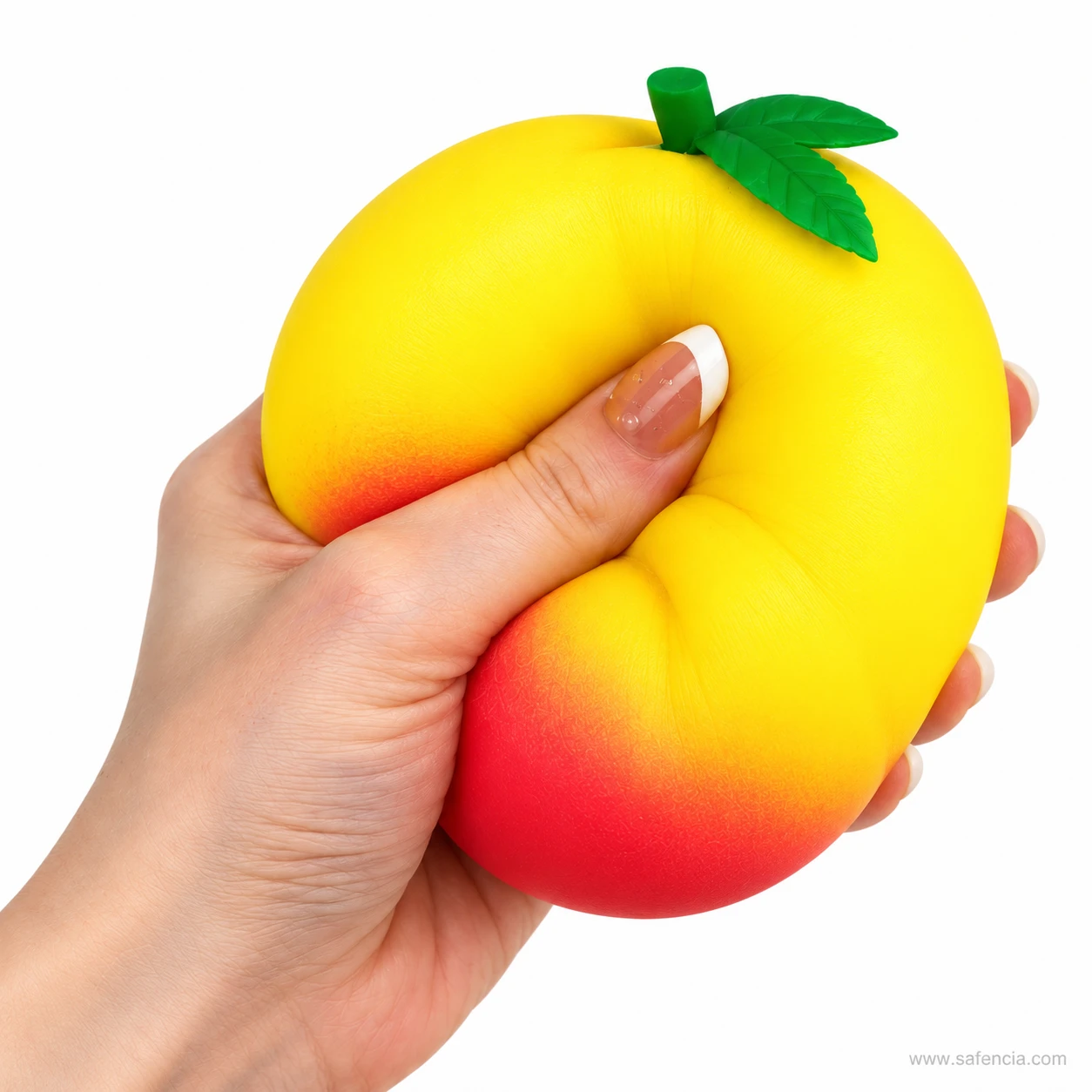 Honey peach squishy squeezed hard in one hand so it folds around the fingers