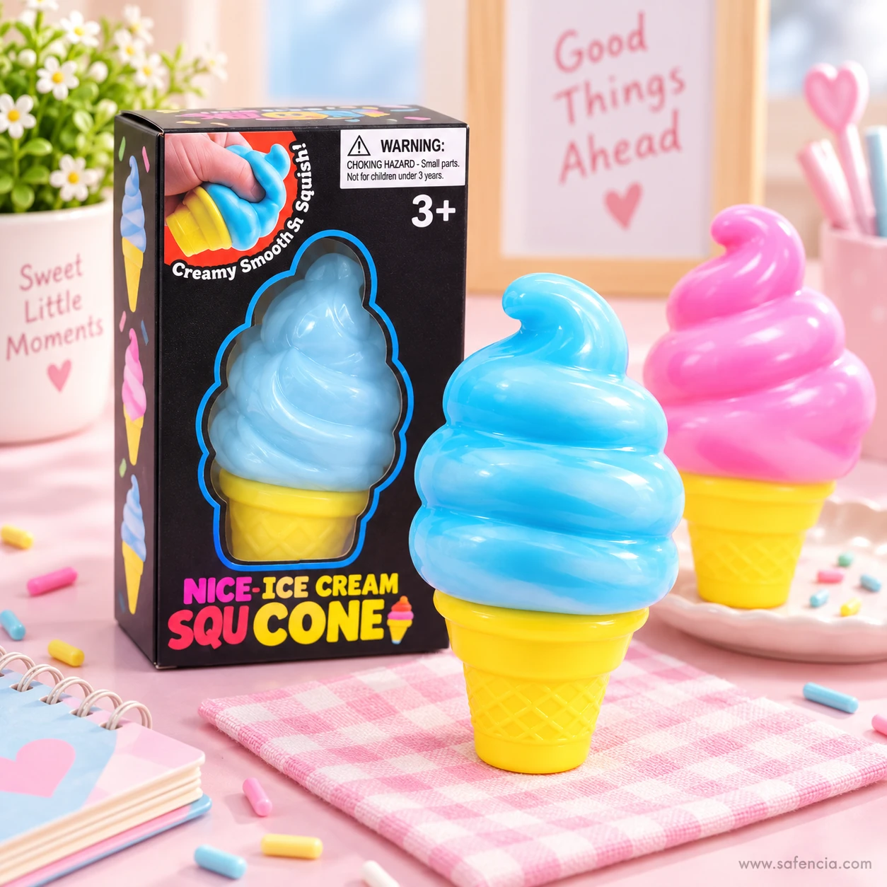 Blue and pink ice cream cone squishies with their box on a pink table with sprinkles