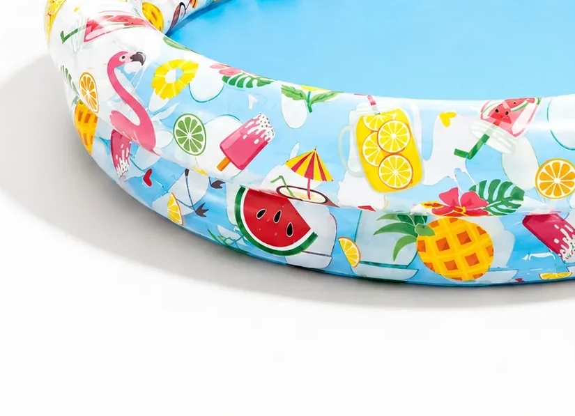 Close-up of the Intex Stargaze pool rings showing watermelon, pineapple and flamingo print
